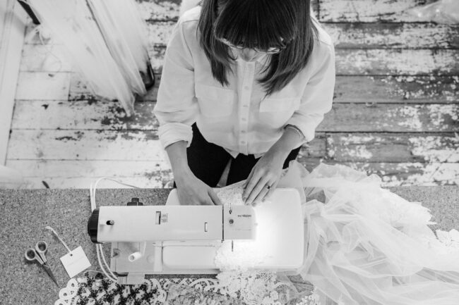Cherry Williams making an alteration to a wedding dress